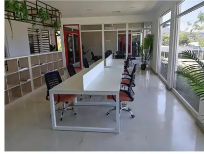 an office with a large white table and chairs at Secure & Confortable Apartment with green spaces in San Rafael
