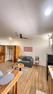 a living room with a couch and a table at GZ Suites in Coco