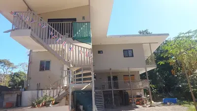 a house with stairs up to the second floor at Pura Vida Jungle Retreat 1 Bed Up in Montezuma