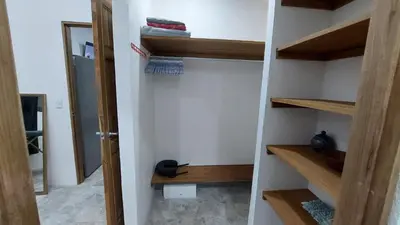 a closet with wooden shelves in a room at Pura Vida Jungle Retreat 1 Bed Up in Montezuma