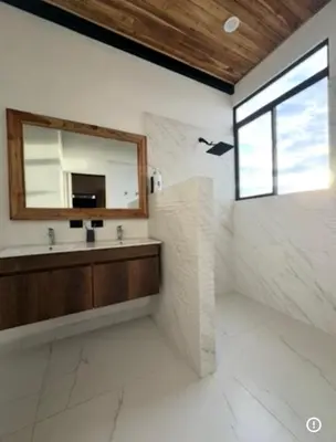 a bathroom with a sink and a mirror at Casa Ángel in Matapalo