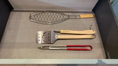 a box with a strainer and a whisk and a knife at Casa Paraíso Boho Uvita Your Piece of Paradise in Uvita