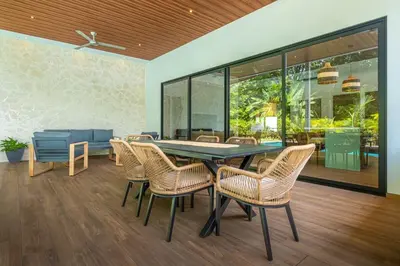 a dining room with a table and chairs at Casa Paraíso Boho Uvita Your Piece of Paradise in Uvita