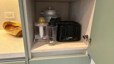 a cupboard with a blender and a mixer in it at Casa Paraíso Boho Uvita Your Piece of Paradise in Uvita