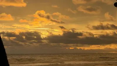 a sunset on the beach with the ocean at Casa Paraíso Boho Uvita Your Piece of Paradise in Uvita