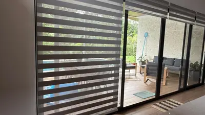 a room with a sliding glass door to a patio at Casa Paraíso Boho Uvita Your Piece of Paradise in Uvita