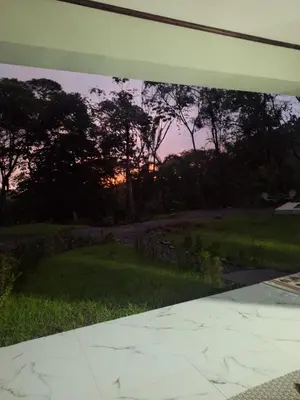a view of a sunset from the outside of a house at Casa Pura vida in Ojochal