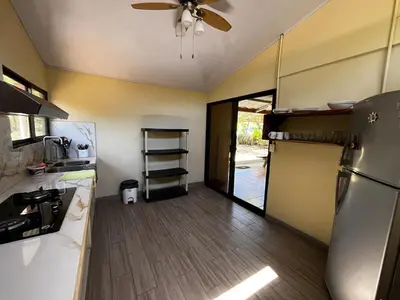 a kitchen with a ceiling fan and a refrigerator at 3-bedroom accommodation in Tamarindo in Garita