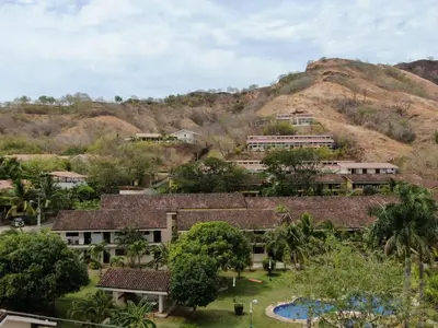 an overview of a resort with a hill in the background at Sea Heaven Ground Floor Studio in Coco