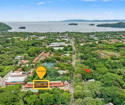 an overhead view of a town with a yellow sign at Plaza Colonial Second Floor One Bedroom Unit in Coco