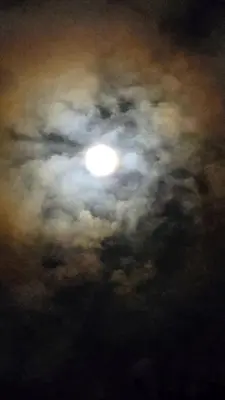 a cloudy sky with the moon in the sky at SeStudio Lodge in Nuevo Arenal with Jungle Views in Nuevo Arenal
