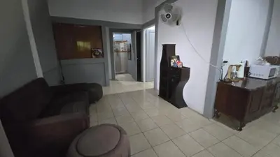 a living room with a couch and a table at Stay at Alexas Nature House in Nuevo Arenal