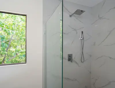 a shower with a glass door in a bathroom at Flamingo Oasis in Playa Flamingo