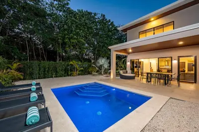 a swimming pool in the backyard of a house at Flamingo Oasis in Playa Flamingo