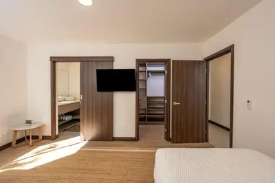 a bedroom with a bed and a flat screen tv at Flamingo Oasis in Playa Flamingo