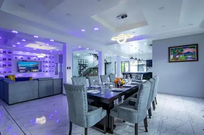 a dining room with a long table and chairs at Villa Montreal in Guayabal