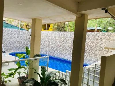 a view of a swimming pool from a house at Apartamentos Santa Teresita in Santa Teresa Beach