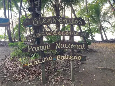 a sign that says welcome to paradise nationalonutonut morongoopolis at 5 min walk to Uvita beach, pool, 3 bdr, AC! in Uvita