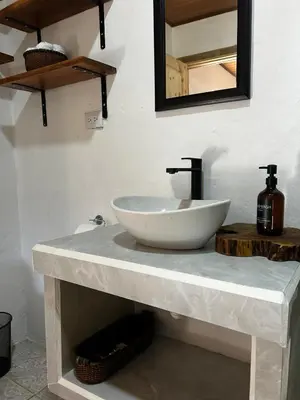 a white sink on a counter in a bathroom at Casa Bahia Heliconia in Uvita