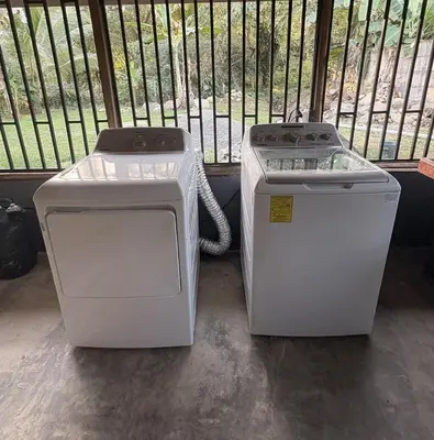 two white trash cans sitting next to each other at Casa Bahia Heliconia in Uvita