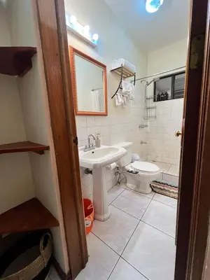 a bathroom with a sink and a toilet at Lotus apartment in San José