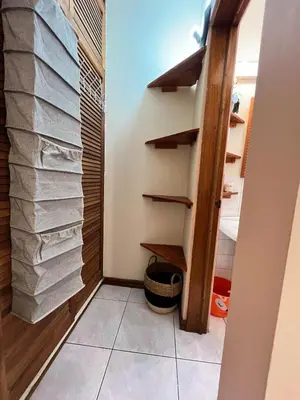 a room with a closet with a pile of towels at Lotus apartment in San José