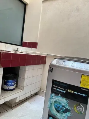 a bathroom with a sign next to a counter at Lotus apartment in San José