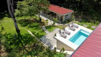 an aerial view of a house with a swimming pool at Casa Rio Tortuga - 2 Rooms in Tortugal