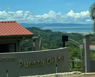 a sign for a disney hotel with a view of the ocean at Casa Rio Tortuga - Butterfly in Ojochal