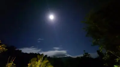 a full moon in the sky at night at Green Horizon in Upala
