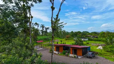 a small house in the middle of a forest at Refugio Las Cortezas in Fortuna