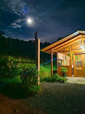 a small building with a moon in the sky at Cerro Lodge & Gardens in Cartago