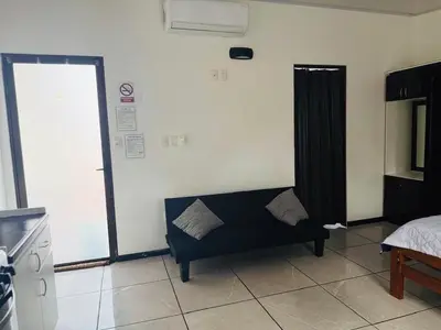a living room with a couch and a window at Casa Mia in Sámara