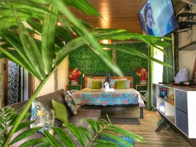 a living room with a couch at Villa Tucan in Agua Azul