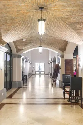 a large hall with a brick ceiling and a piano at 2 Bedroom Condo in Croc's Casino Resort in Jacó