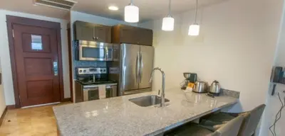 a kitchen with a sink and a counter top at 2 Bedroom Condo in Croc's Casino Resort in Jacó