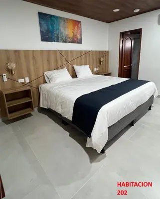 a bedroom with a large bed in a room at Habitación Sabana Norte 200m Estadio Nacional San José in San José