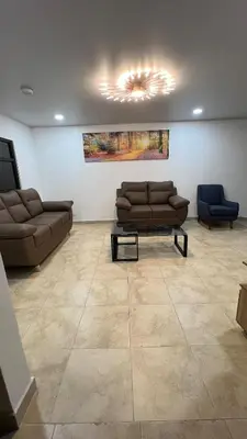 a living room with two couches and a table at Habitación Sabana Norte 200m Estadio Nacional San José in San José