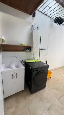 a kitchen with a washing machine and a sink at Habitación Sabana Norte 200m Estadio Nacional San José in San José
