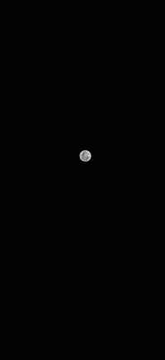 a moon in the sky in the dark at Cabaña Brisas Del Río in Parrita