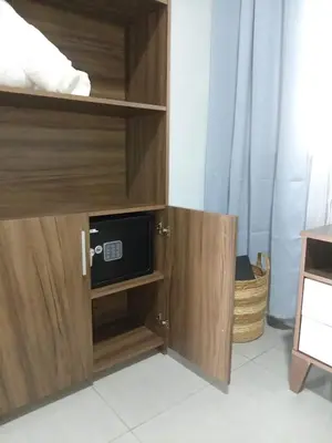 a cupboard with a microwave and a tv in it at La casita de chelo in Fortuna