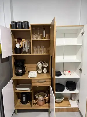 a kitchen with wooden shelves and dishes in it at La casita de chelo in Fortuna