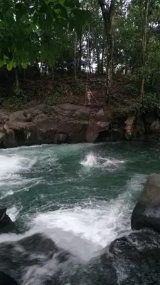 a river with white rapids on top of it at La casita de chelo in Fortuna