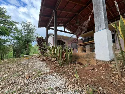 a house on the side of a hill at Pura Noche Guanacaste in Marbella