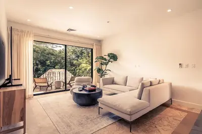 a living room with a couch and a table at Casa Tanamera 5BR Private Retreat in Hacienda Pinilla in Tamarindo