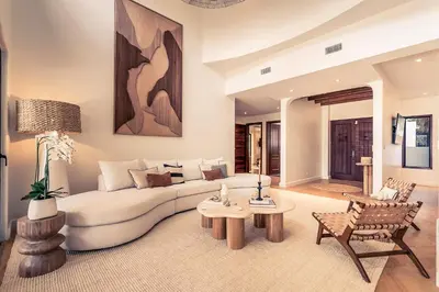 a living room with a white couch and a table at Casa Tanamera 5BR Private Retreat in Hacienda Pinilla in Tamarindo