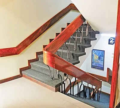 a staircase in a house with a stair case at Hotel Ambassador in San José