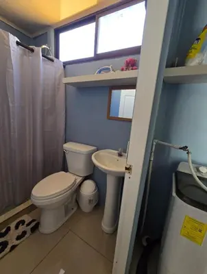 a small bathroom with a toilet and a sink at Apartamento DesCANsO #1 in Palmira