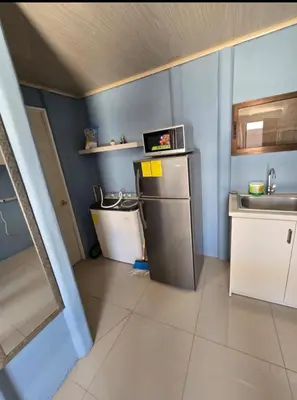 a small kitchen with a sink and a refrigerator at Apartamento DesCANsO #1 in Palmira