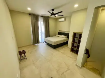 a bedroom with a bed and a ceiling fan at Langosta apartment in Tamarindo